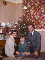 [Family photo with Christmas tree]
