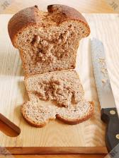 [Ropy loaf with caked knife]